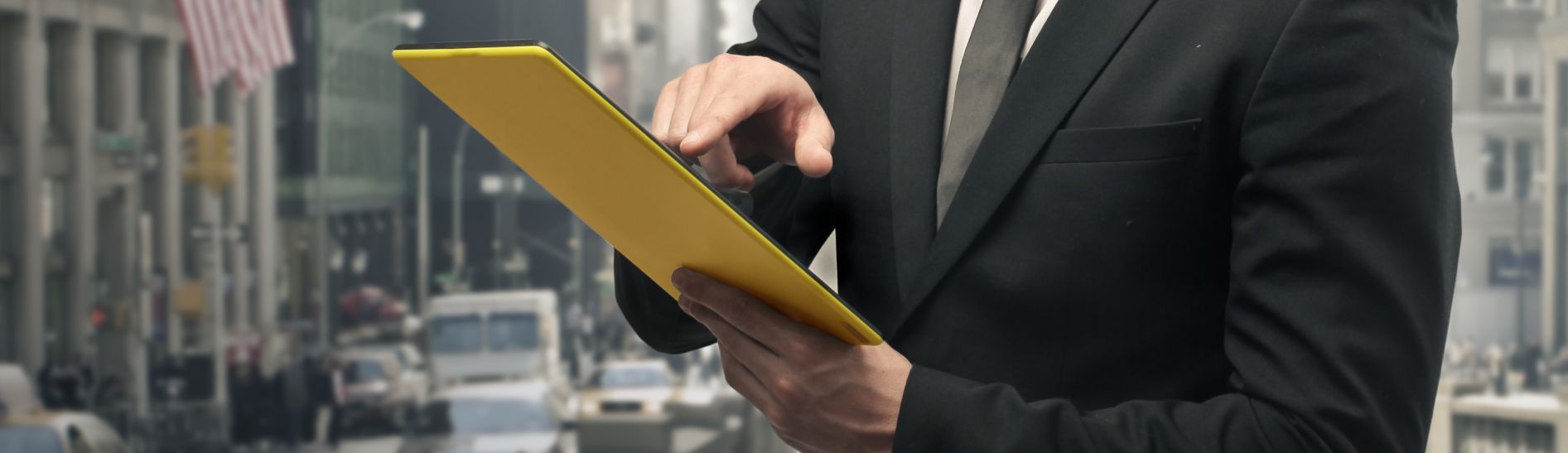 A business owner reviewing a press release on a tablet
